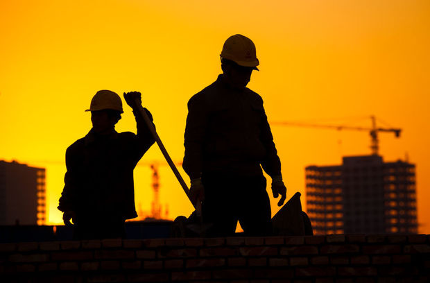 Silhouette of a construction worker.